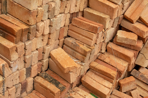 pile of bricks which is prepared for construction. red brick wall at the construction site.