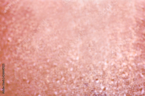Blurred view of shiny rose gold surface as background