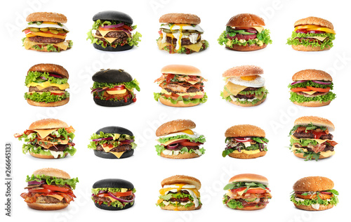 Set of delicious burgers on white background photo