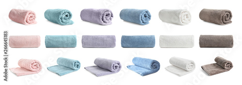 Set of different clean terry towels on white background photo