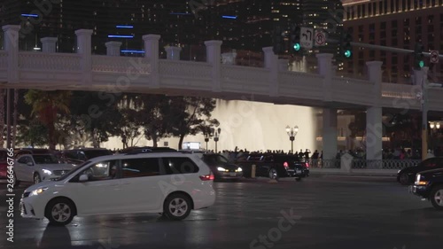 Street lights and the traffic in a car crossing of Las Vegas, Nevada, United States during night time in slow motion.