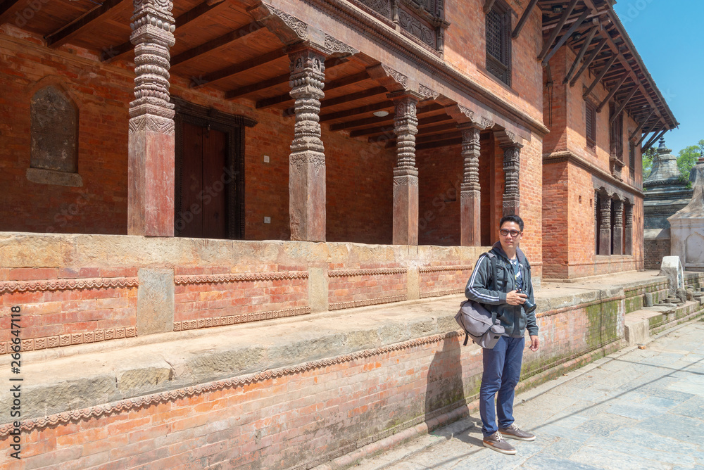 An asian man tourist enjoy viewing historic building at Gorakhnath Temple, Nepal
