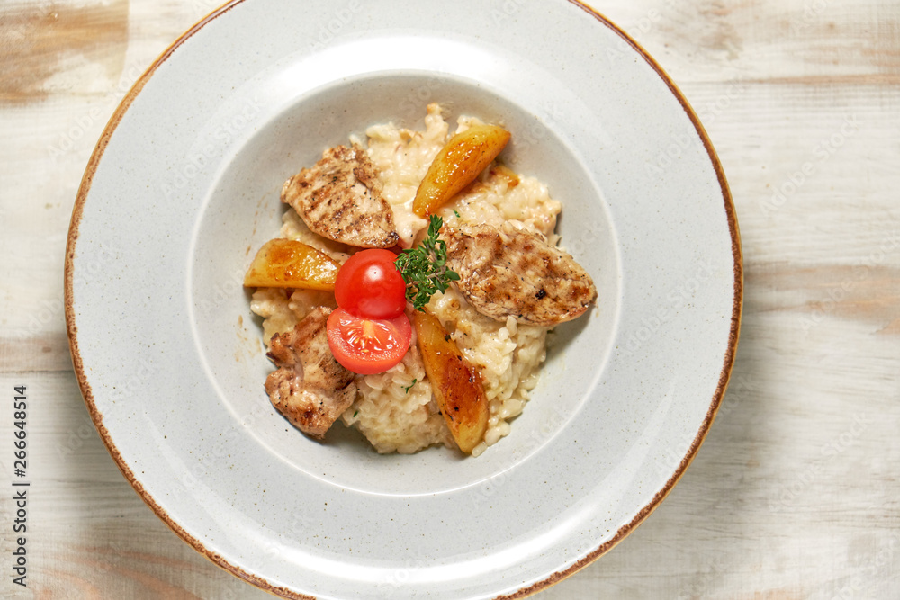 Grilled chicken with white rice. Light wooden background. Restaurant menu