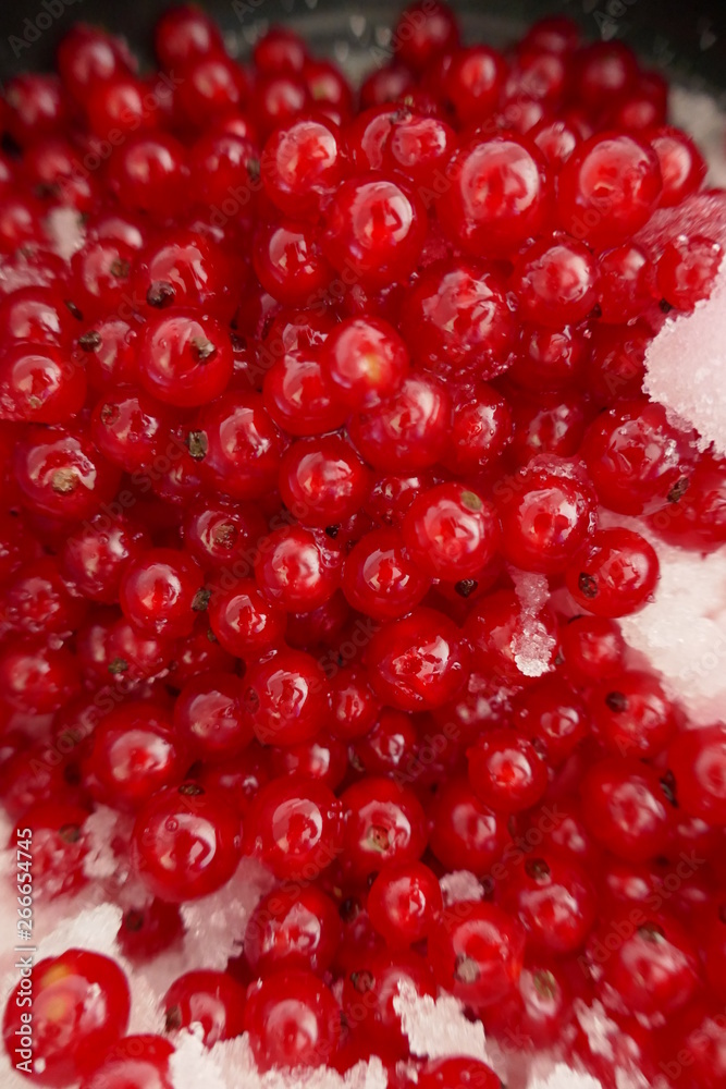 red currant berries with sugar macro background.Red currant jam.Summer berry. red currant berries with sugar macro background.Red currant jam.Summer berry.