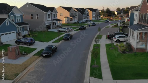 Typical American luxury real estate single family houses on a new construction development street East Coast USA aerial view photo