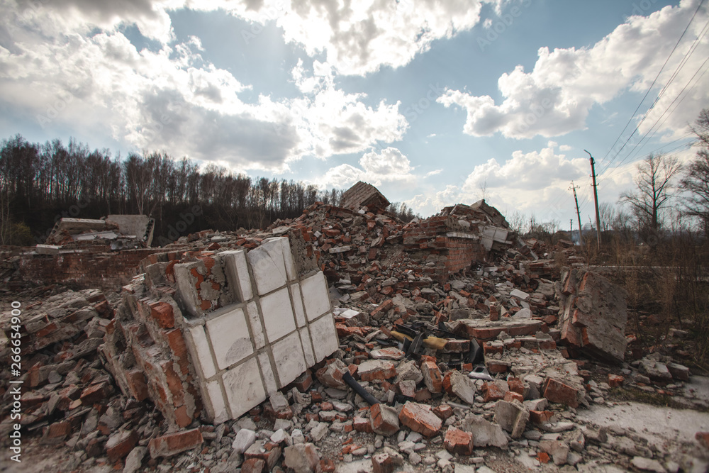 Destroying House The ruins of a brick house. The house is destroyed, a natural disaster ...