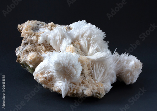 Isolated Scolecite mineral made of sprays of thin, prissmatic needles crystals. Scolecite is a tectosilicate mineral belonging to the zeolite group.