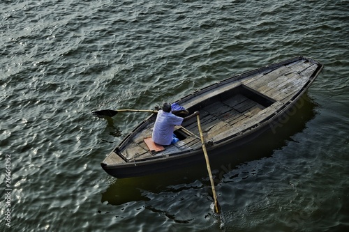 A tired Boatman returning Home after full day of hard labour  © Akash