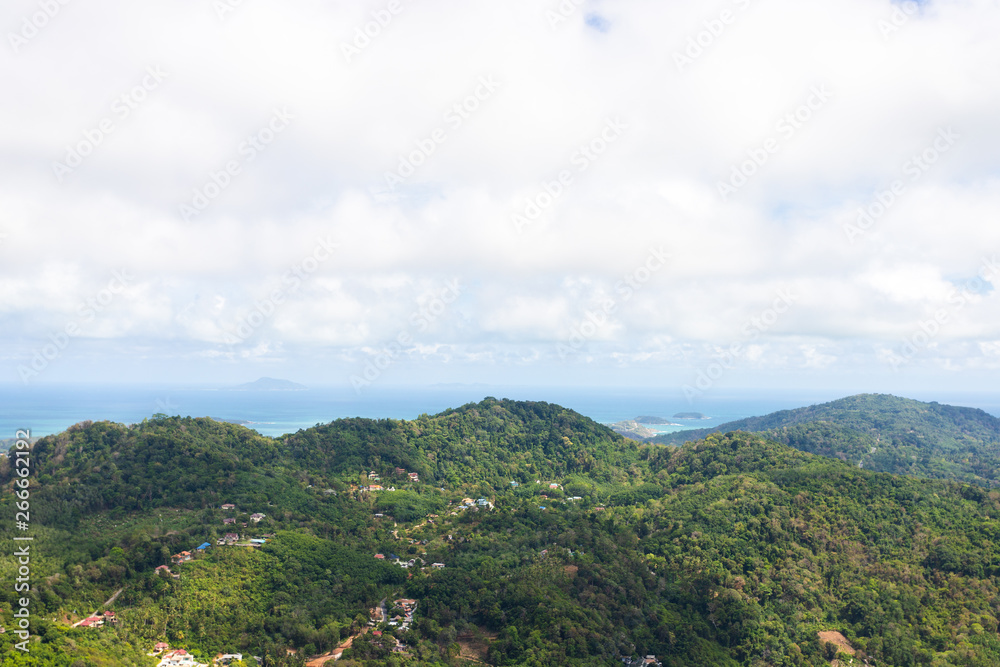Fototapeta premium mountain scape with some village on there and can see the beach from Phuket island with cloudy sky