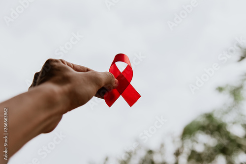 Red ribbon for world aids day awareness campaign background. photo