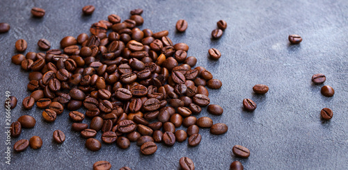 Coffee beans on grey slate background. Copy space.