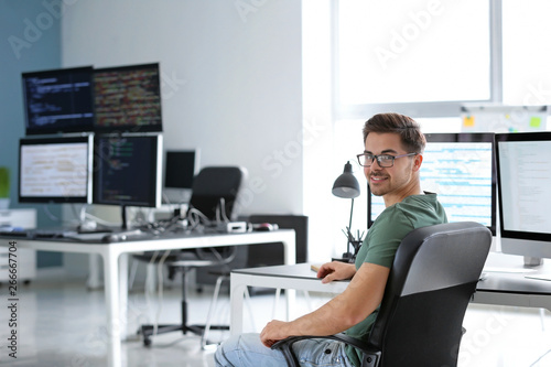Portrait of male programmer in office photo