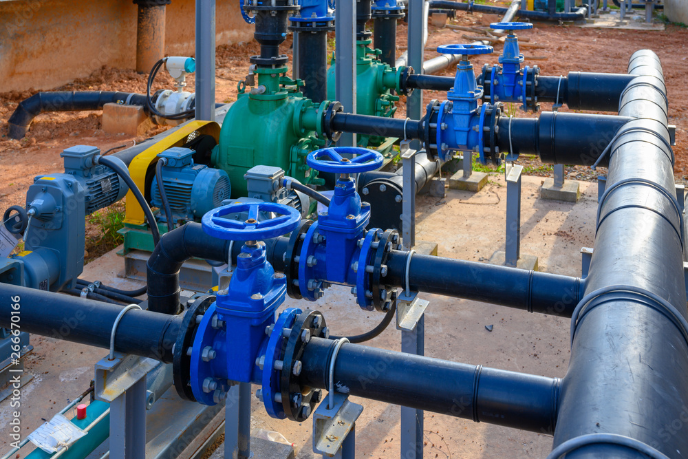 Equipment, cables and piping as found inside of a industrial power plant Equipment, cables and piping as found inside of a industrial power plant