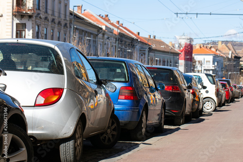 Vehicles in city downtown's parking lot