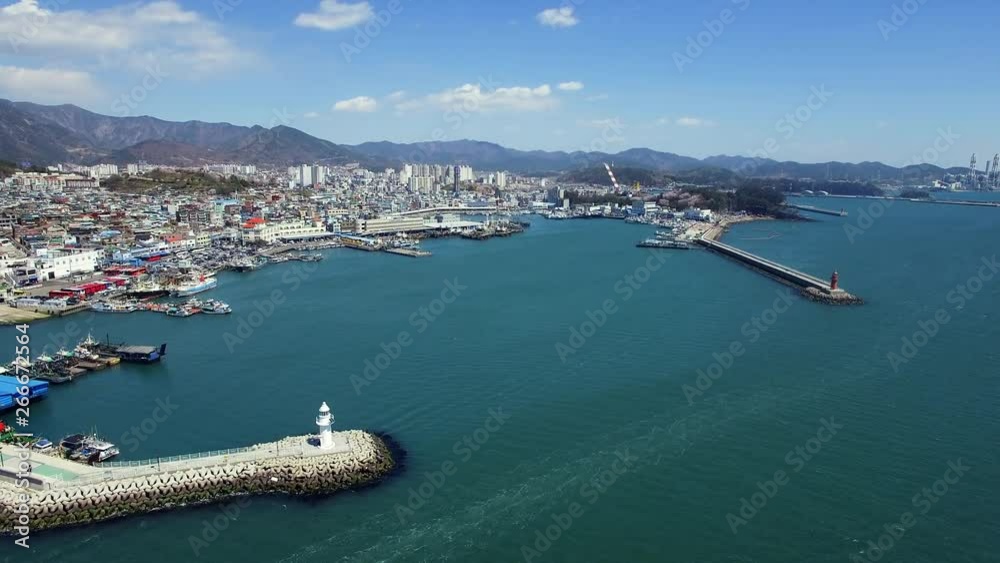 Sacheon City, a lighthouse near the port, samcheonpo, bird's eye view drone shot, clear day Sacheon City, a lighthouse near the port, samcheonpo, bird's eye view drone shot, clear day