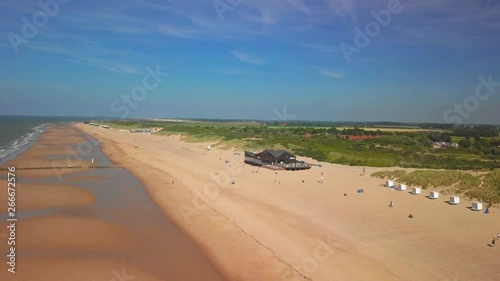 The beach of Cadzand-Bad, the Netherlands during a sunny day. Aerial shot. photo