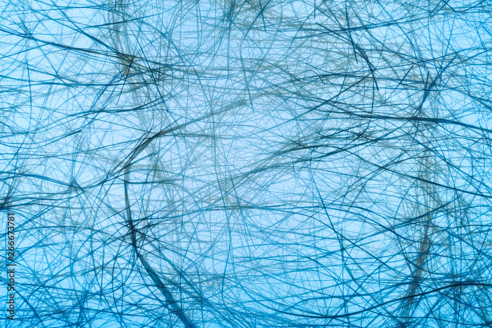 Obraz premium mulberry paper with warm light behind blue translucent paper. use texture for background