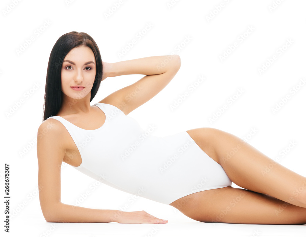 Fototapeta premium Young, fit and beautiful brunette girl in white swimsuit.