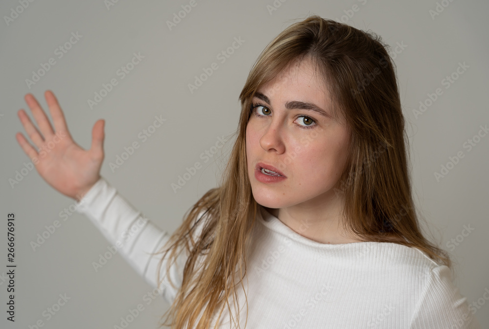 Portrait of a beautiful emotional young woman looking furious and angry. Human expressions Portrait of a beautiful emotional young woman looking furious and angry. Human expressions