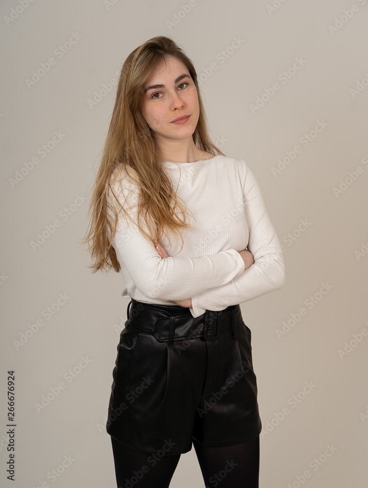 Portrait of a beautiful teen girl with happy and smiling face. In beauty, model and fashion concept Portrait of a beautiful teen girl with happy and smiling face. In beauty, model and fashion concept