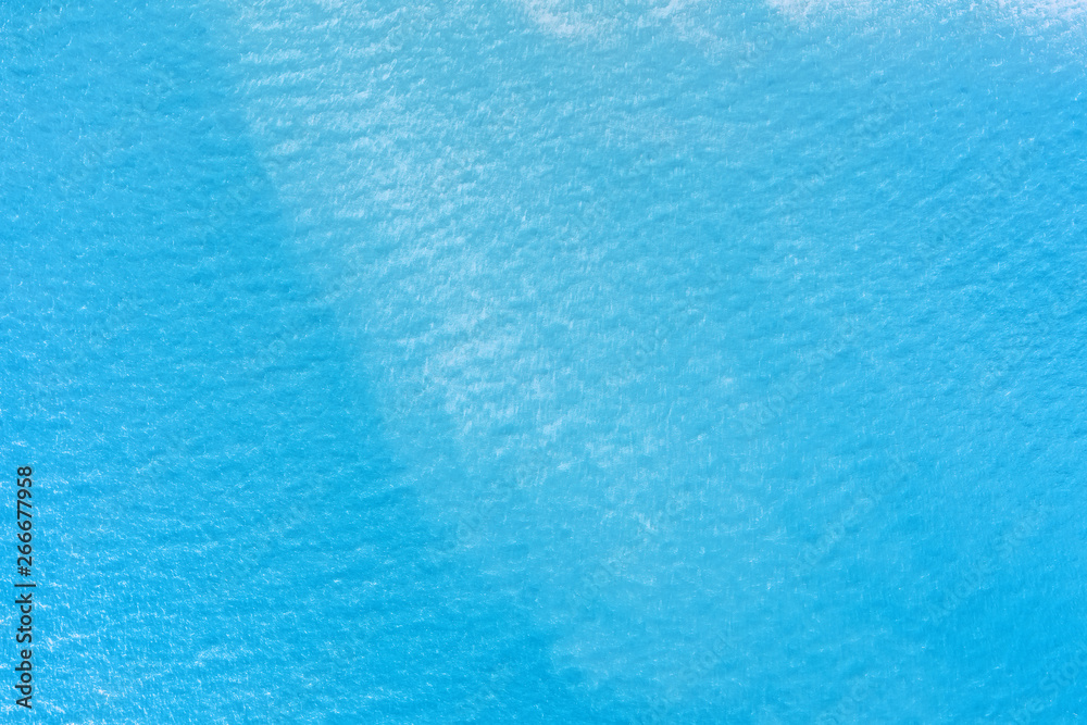 Aqua blue calm sea surface aerial view for background