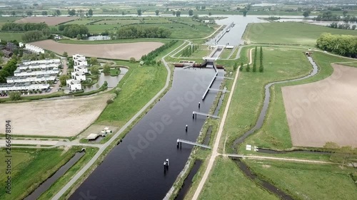 Drone footage of the suburban near the big canal in Holland photo