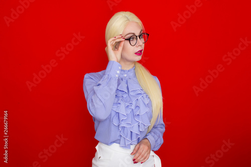 Blonde business woman wearing eyeglasses