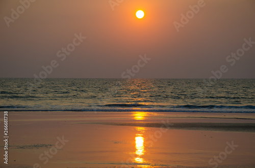 Sunset over a sea smooth surface a beautiful landscape