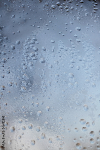Raindrops on the glass. Depressive abstract background. Summer autumn bad weather © queen1987