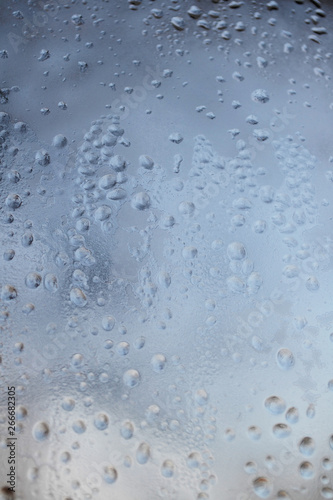 Raindrops on the glass. Depressive abstract background. Summer autumn bad weather