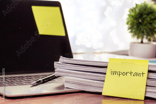 Stack of important documents placed on a business desk in a business office. photo