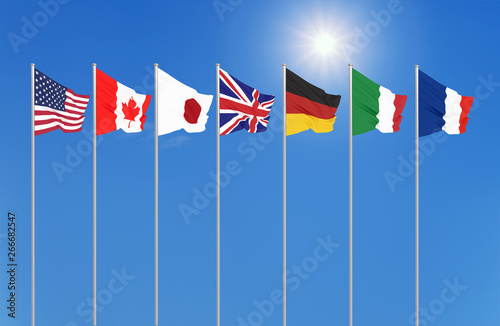 Silk waving G7 flags of countries of Group of Seven Canada, Germany, Italy, France, Japan, USA states, United Kingdom. Blue sky background. Big G7 in France 2019. 3D illustration.