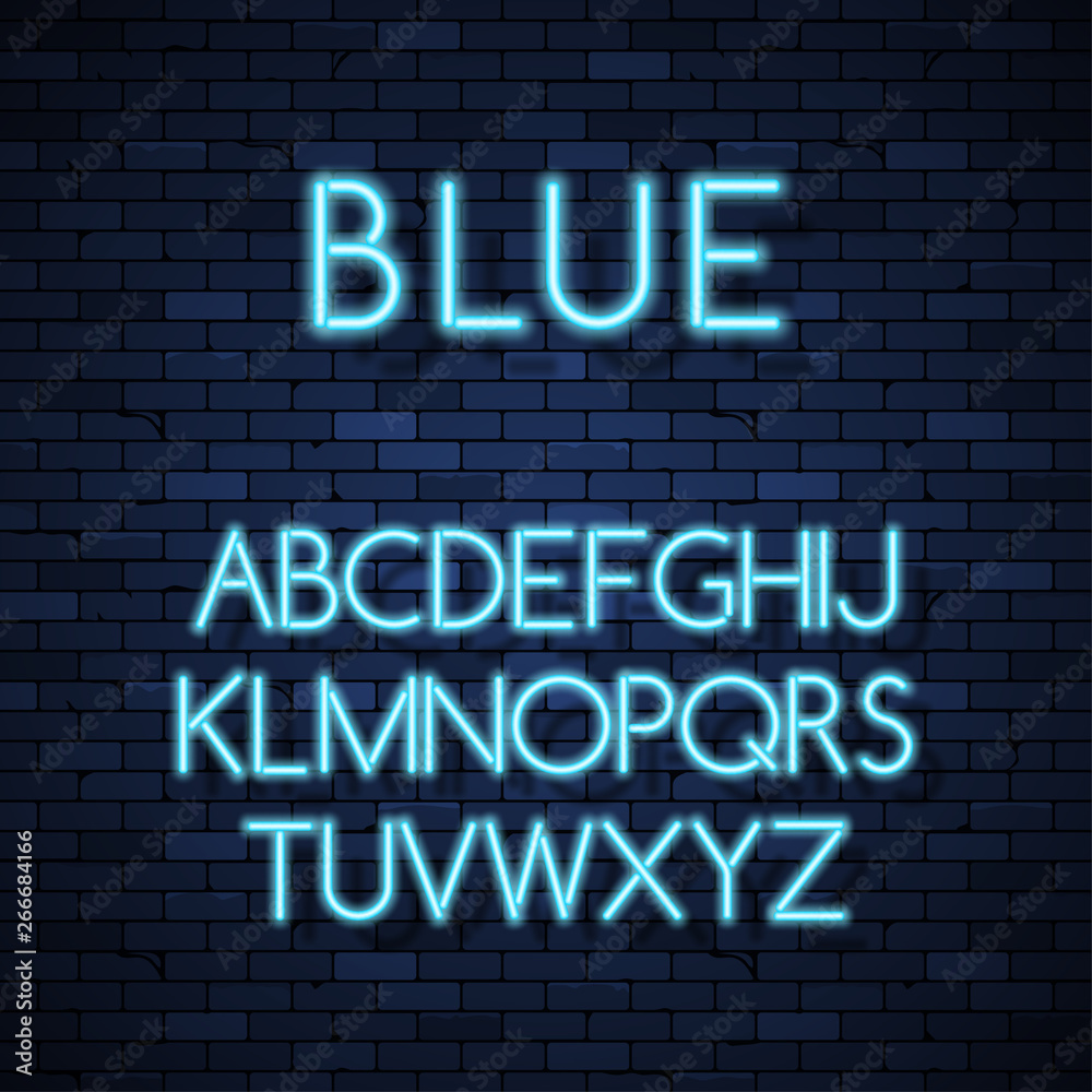 Obraz premium Glowing neon alphabet on brick wall background