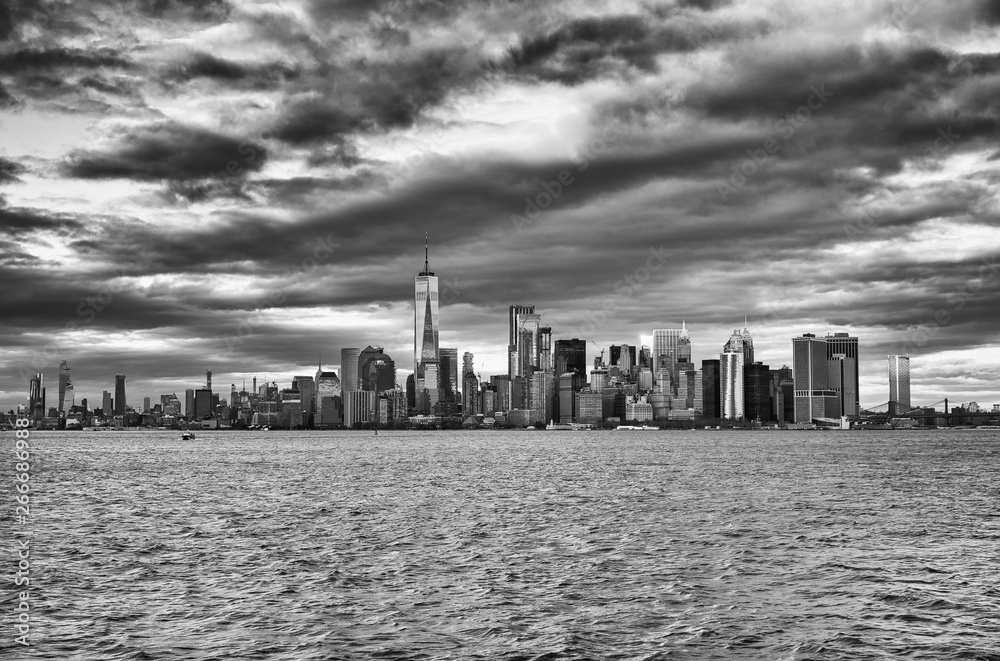 Amazing sunset skyline of Lowr Manhattan from a ferry boat
