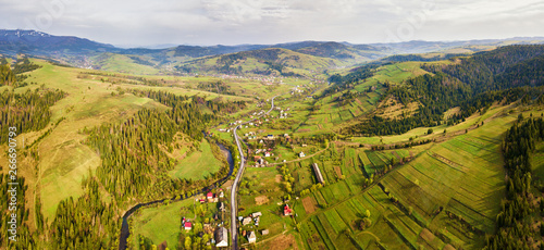 Fototapeta Naklejka Na Ścianę i Meble -  Rural spring misty landscape. Aerial Panorama of Carpathian valley.