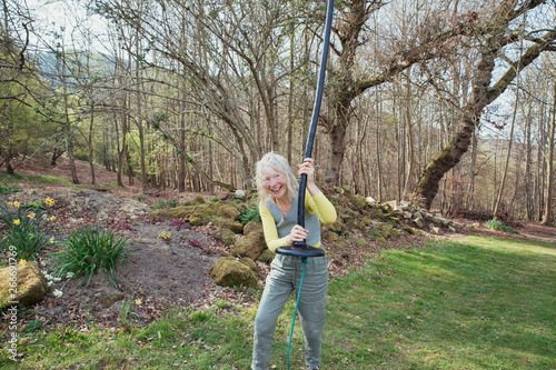 Senior Woman Having Fun on a Swing photo