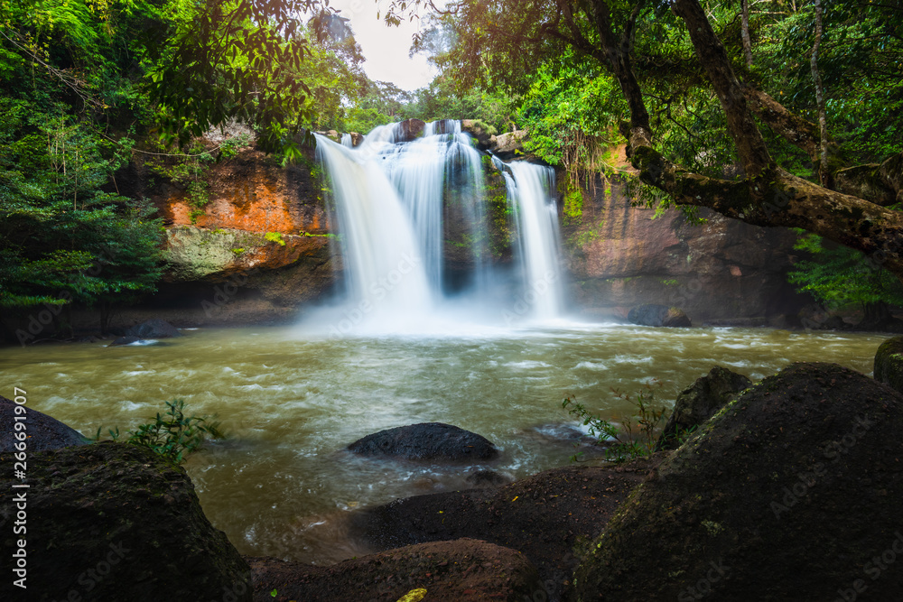 Obraz premium Landscape of peaceful waterfall in the tropical rainforest