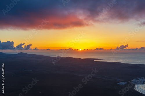 Landscape of Lanzarote coastline at sunset