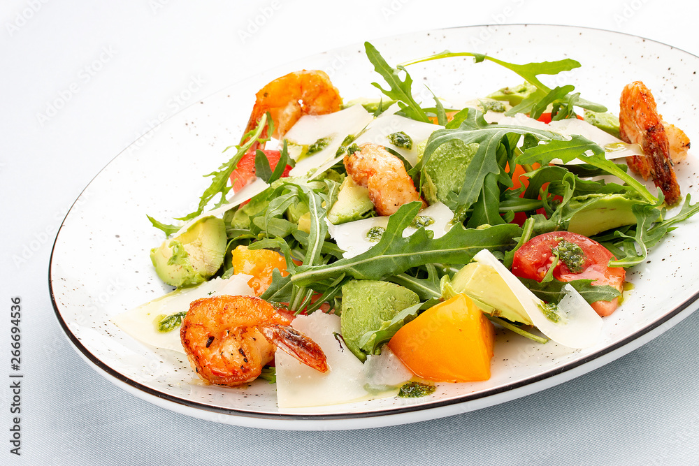 Salad with arugula, shrimp and avocado, parmesan cheese Salad with arugula, shrimp and avocado, parmesan cheese