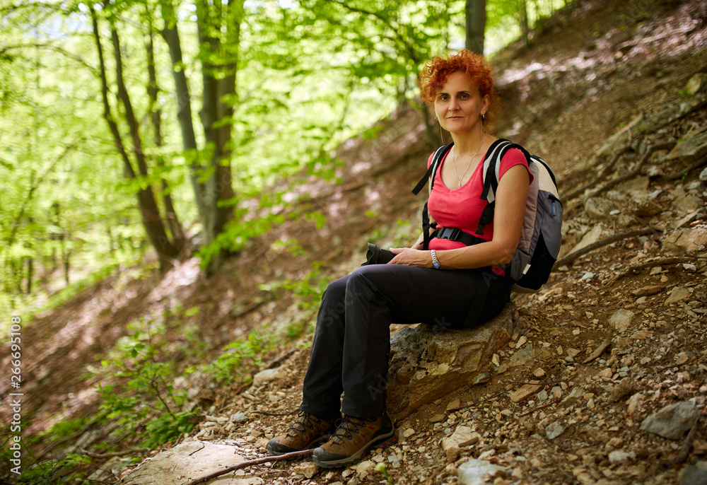 Woman hiking in the forest Woman hiking in the forest