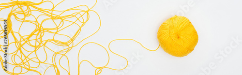 Fotografia, Obraz panoramic shot of knitting ball and yellow yarn Isolated On White
