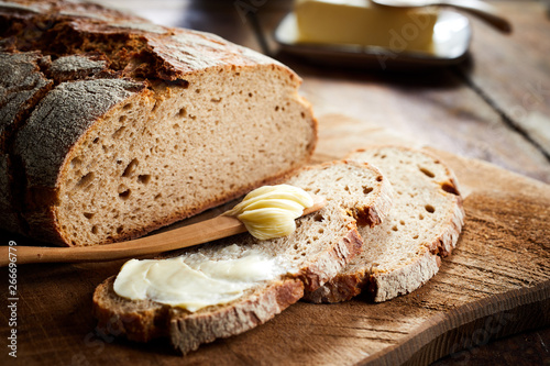 Buttered slice of freshly bake rye bread