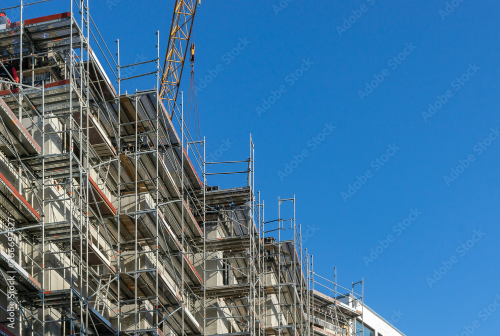 building under construction - scaffolding at the outside of a building