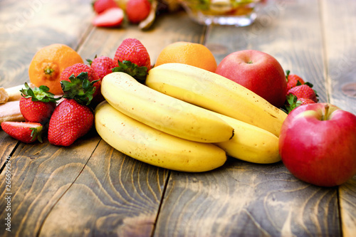 Fresh organic fruit  healthy vegetarian food on rustic table