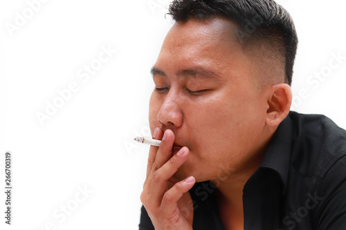 Closeup portrait of smoking young man, isolated on white background.