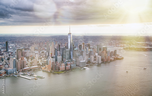 New York City from helicopter point of view. Downtown Manhattan, Jersey City and Hudson River on a cloudy day