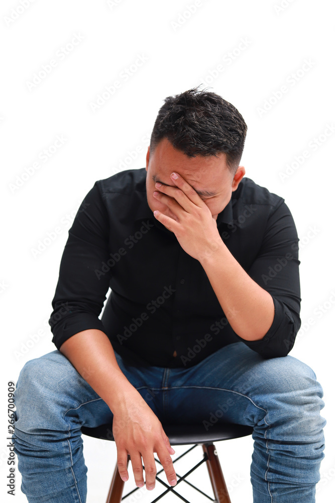 Depressed young asian man suffering from headache, isolated on white background. Depressed young asian man suffering from headache, isolated on white background.