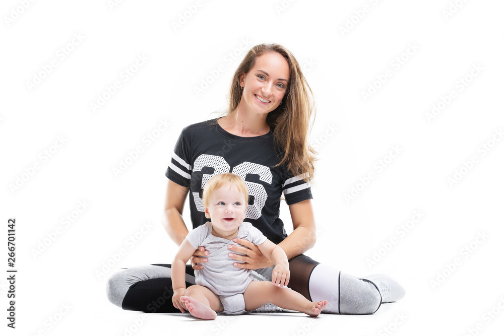 Smiling mother is sitting with happy child at white iosolated background. Concept of happy family. Smiling mother is sitting with happy child at white iosolated background. Concept of happy family.