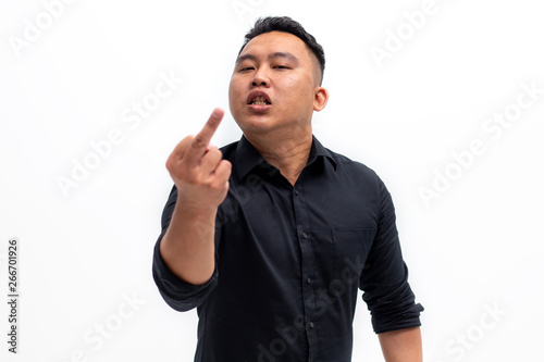 Fotografie Rude man displeased about something and showing the middle finger