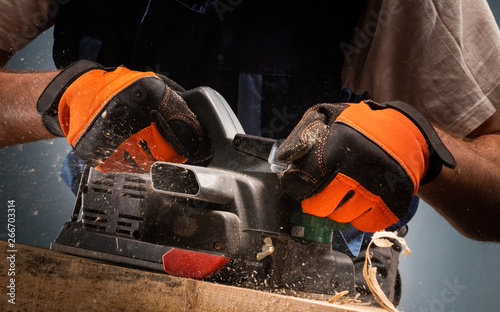 Wallpaper Mural Carpenter works with electrical planer Torontodigital.ca